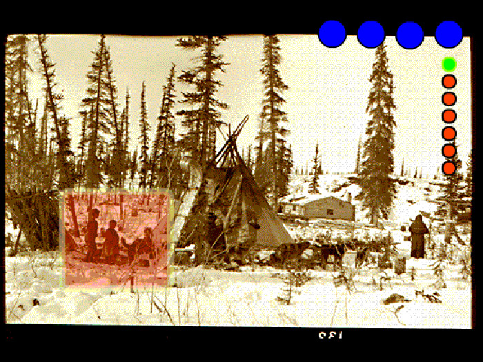 Archival photo of native children in front of winter tipi with cabin n background, coloured dots superimposed